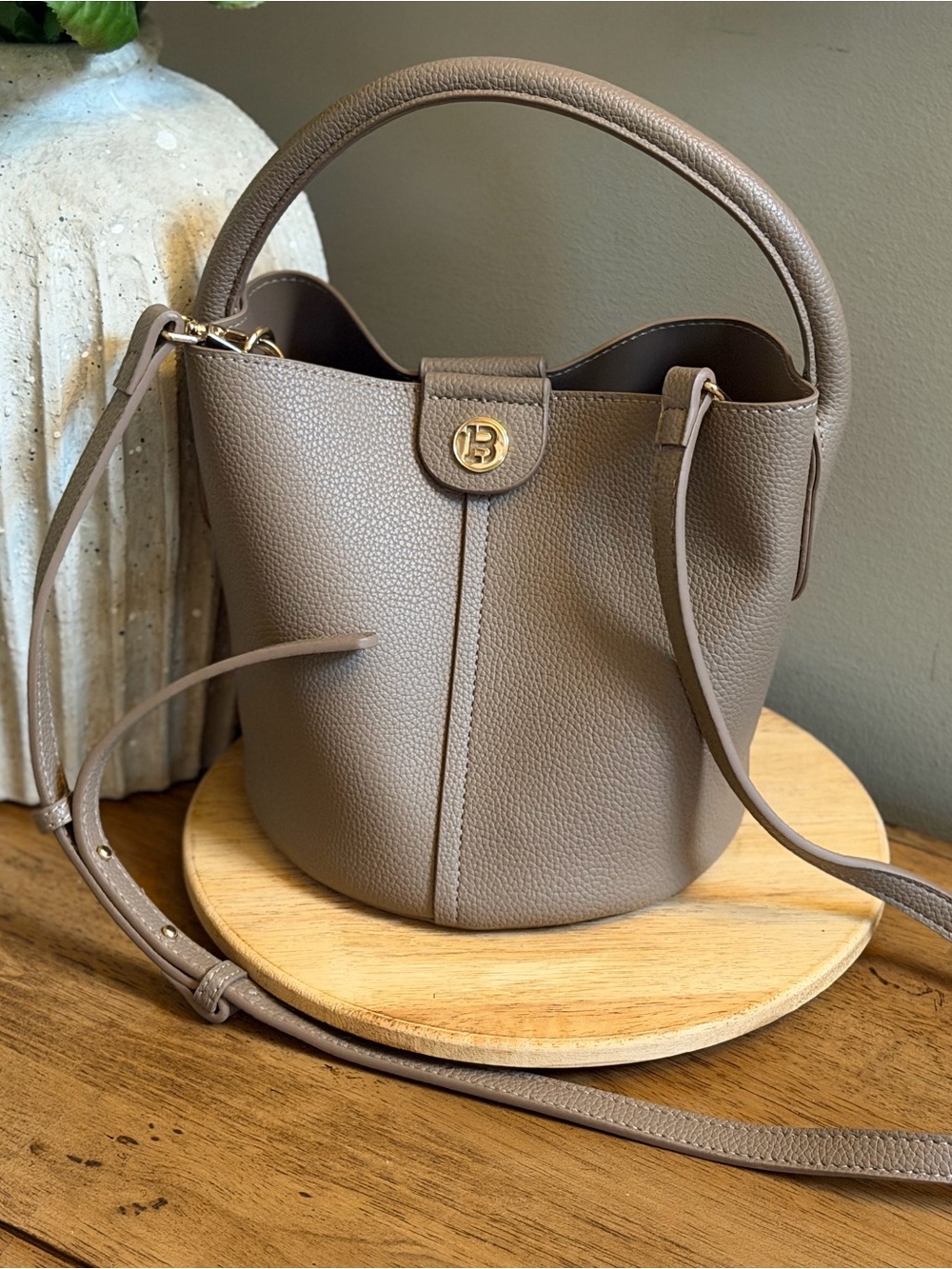 Taupe Leather Bucket Bag with Top Handle and Crossbody Strap